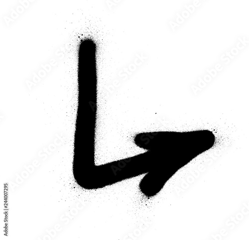 graffiti sprayed pointing arrow in black over white