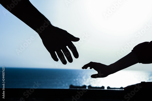 Beautiful arms of the parent and child silhouette of the background