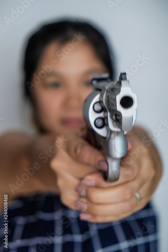 Women shooting target with .357 .44 magnum revolver gun