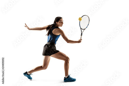 Full length portrait of young woman playing tennis isolated on white background. Healthy lifestyle. The practicing, fitness, sport, exercise concept. The female model in motion or movement © master1305