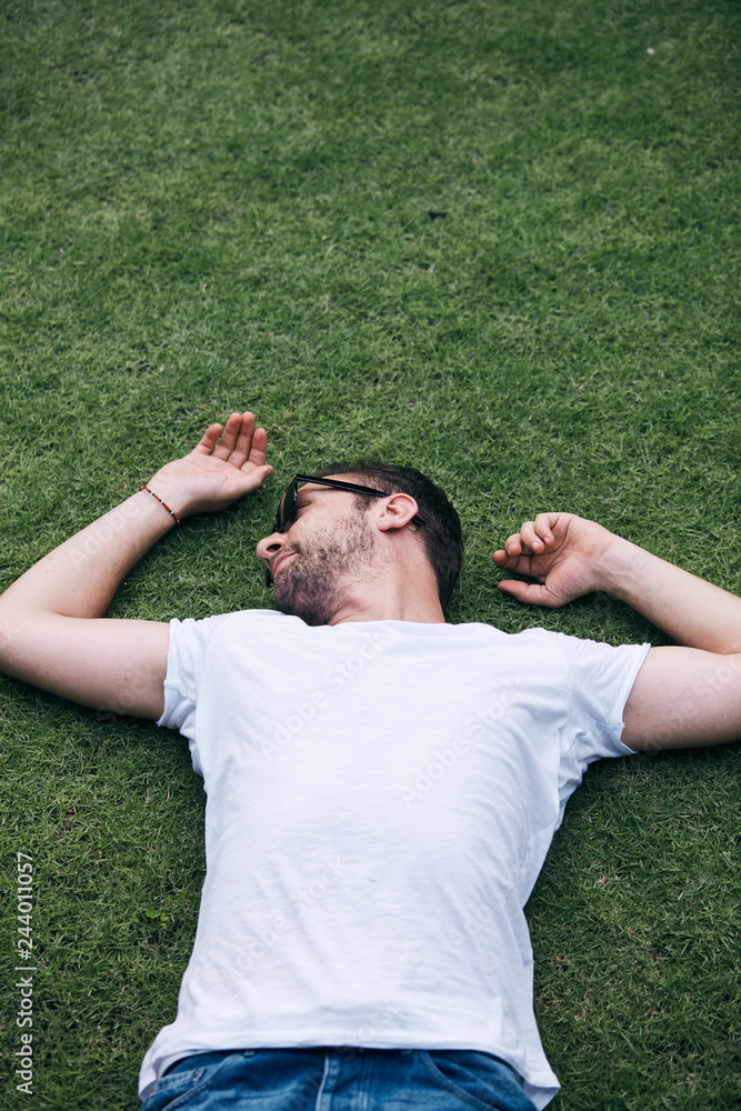 Man enjoying in summertime on a grass field. Man enjoying in summertime on a grass field.