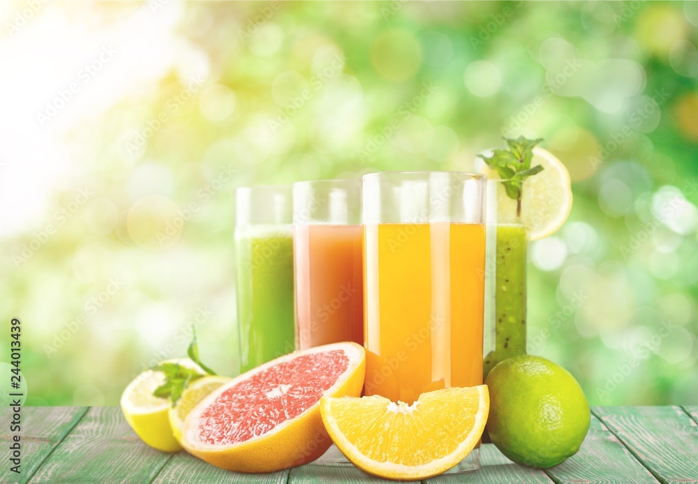 Tasty fruits and juice on wooden table Tasty fruits and juice on wooden table