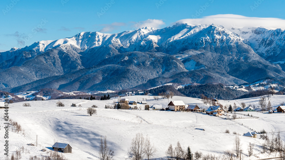 Brasov - Romania, Rucar - Bran snowy picturesque hills on a sunny cold December.