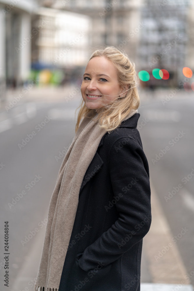 Happy and cheerful businesswoman with blonde hair in the city of London Happy and cheerful businesswoman with blonde hair in the city of London