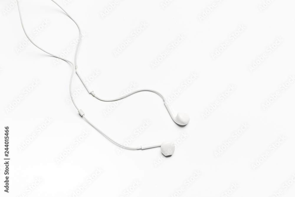 Obraz premium white Earphones isolated on white background