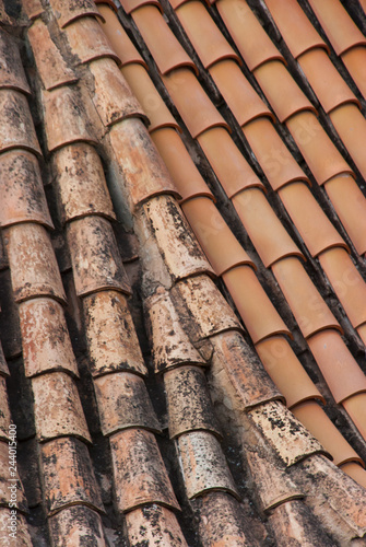Old tile roof.Terracota background. Exterior pattern. © Etnika