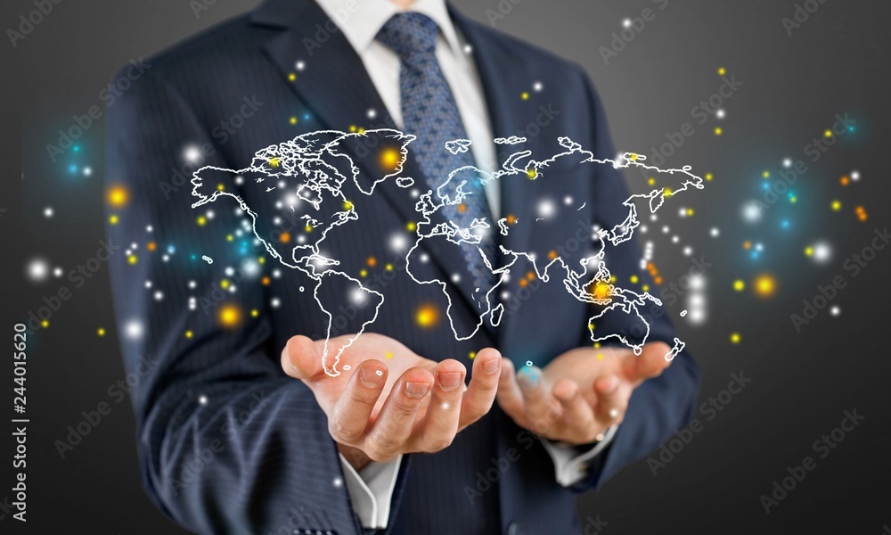 Close up of businessman holding digital globe in palms Close up of businessman holding digital globe in palms
