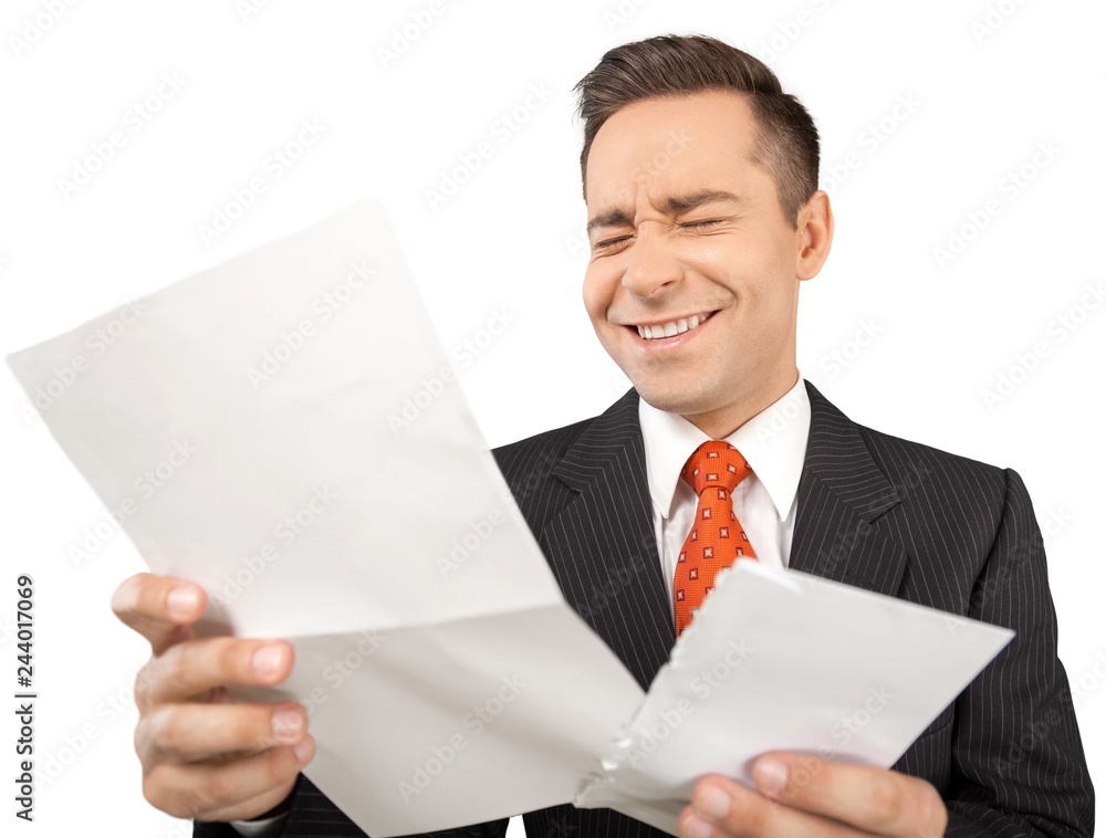 Young handsome business man with paper isolated on white Young handsome business man with paper isolated on white