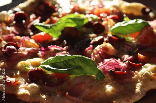 Pizza with meat and greens