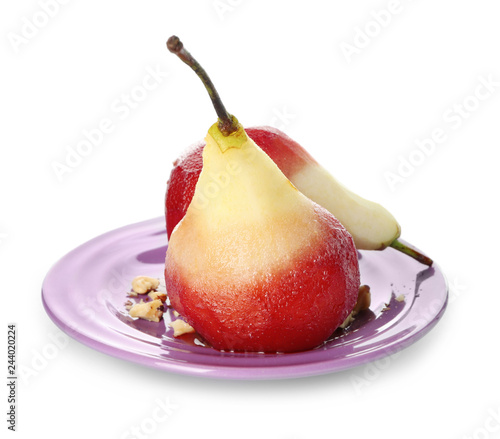 Plate with delicious poached pears in red wine on white background