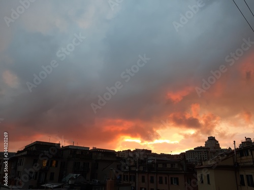 Genova  Italy - 06 17 2018  An amazing sunset over the city of genova in spring days with some clouds and great reflection over the buildings