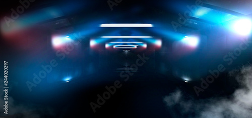 Dark tunnel, corridor, rays of light, searchlights, light in windows, red laser. Abstract black tunnel, smoke, wet asphalt, night view. © MiaStendal