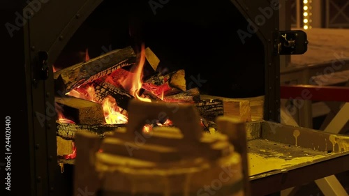 Sakotis or raguolis, tree cake or branchy pastry, Polish-Lithuanian traditional spit cake, cooked on open fire. photo