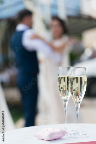 two glasses of champagne for the newlyweds on the table