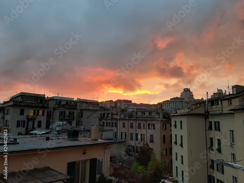 Genova  Italy - 06 17 2018  An amazing sunset over the city of genova in spring days with some clouds and great reflection over the buildings