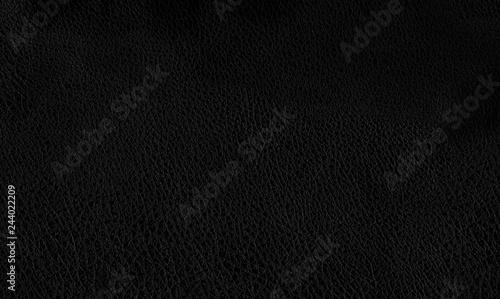 Deep dark black color luxury genuine cow leather texture background. Close up photography of sofa, chair, interior, auto seat cover