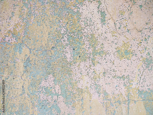 Old grunge cracked vintage light grey concrete and cement mold texture wall or floor background with pink weathered paint and scratches