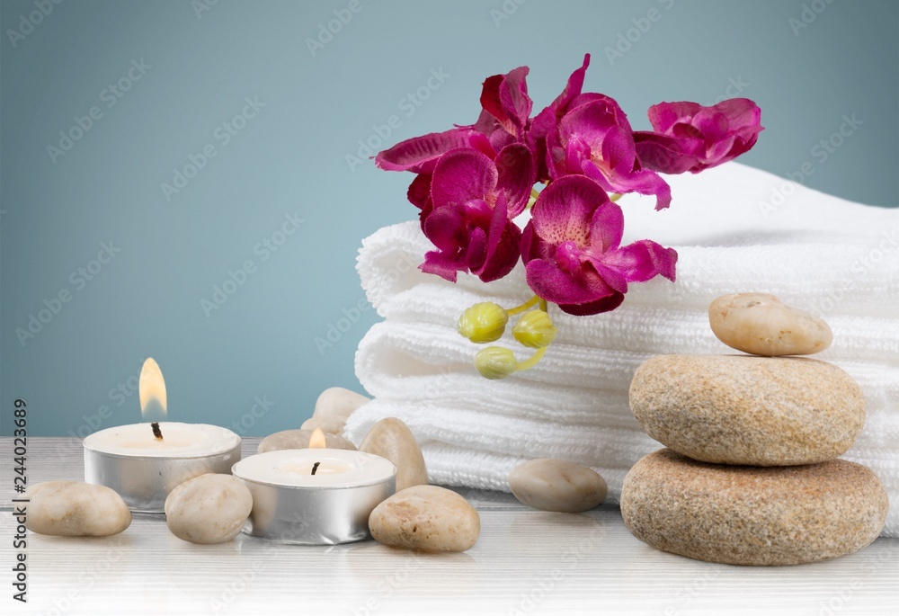 Laundry Basket with colorful towels on background Laundry Basket with colorful towels on background