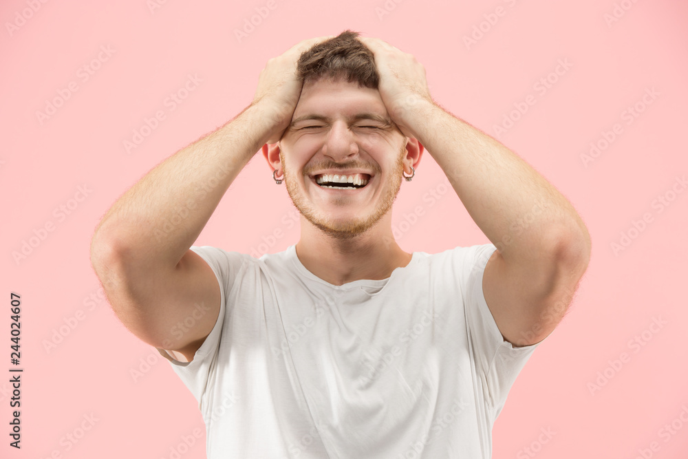 I won. Winning success happy man celebrating being a winner. Dynamic image of caucasian male model on pink studio background. Victory, delight concept. Human facial emotions concept. Trendy colors I won. Winning success happy man celebrating being a winner. Dynamic image of caucasian male model on pink studio background. Victory, delight concept. Human facial emotions concept. Trendy colors