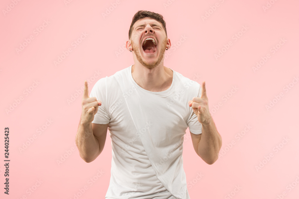 I won. Winning success happy man celebrating being a winner. Dynamic image of caucasian male model on pink studio background. Victory, delight concept. Human facial emotions concept. Trendy colors I won. Winning success happy man celebrating being a winner. Dynamic image of caucasian male model on pink studio background. Victory, delight concept. Human facial emotions concept. Trendy colors