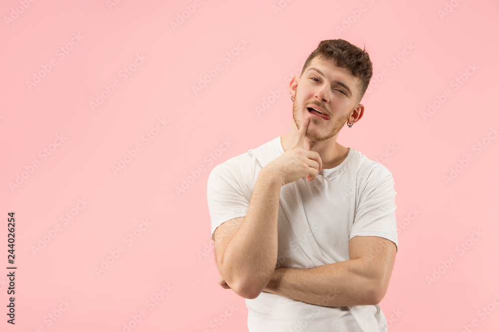 Remember all. Let me think. Doubt concept. Doubtful, thoughtful man remembering something. Young emotional man. Human emotions, facial expression concept. Studio. Isolated on trendy pink Remember all. Let me think. Doubt concept. Doubtful, thoughtful man remembering something. Young emotional man. Human emotions, facial expression concept. Studio. Isolated on trendy pink