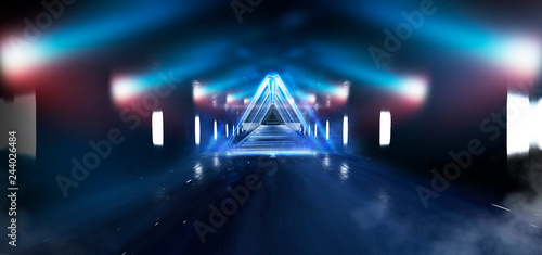    Abstract black tunnel with a light pyramid, neon triangle, smoke, wet asphalt, night view.