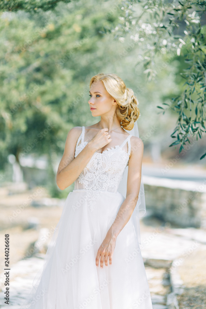 Bride in the mountains with a beautiful view of Cyprus. A wedding dress and a happy girl. Bride in the mountains with a beautiful view of Cyprus. A wedding dress and a happy girl.