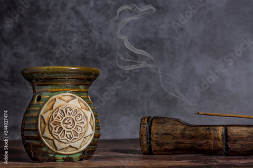 Essential oil burner on a grey stone background
