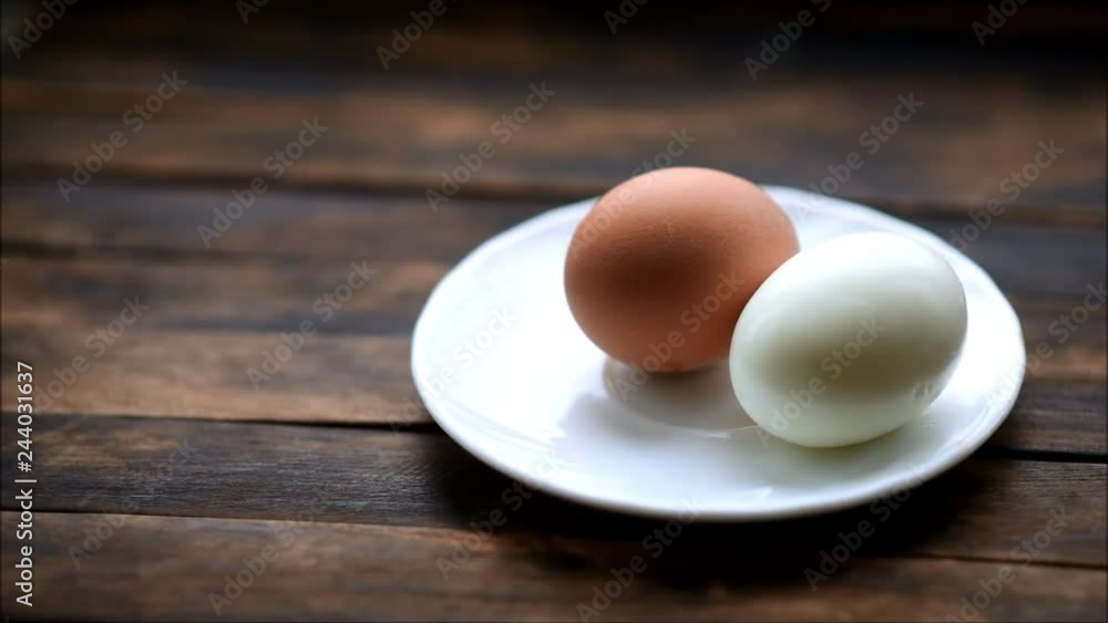 boiled chicken eggs on a plate on a wooden table boiled chicken eggs on a plate on a wooden table