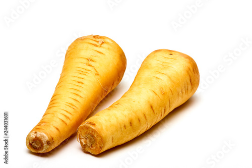 Raw parsnips isolated on a white background