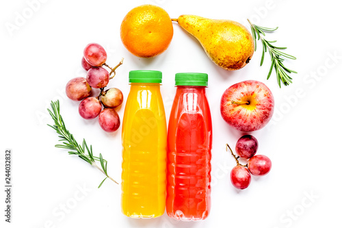 bottles of smoothie with fruits on white table top view mock up