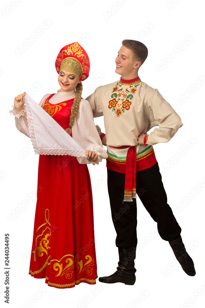 Beautiful caucasian cuple dancing in Russian folk costumes isolated on white
