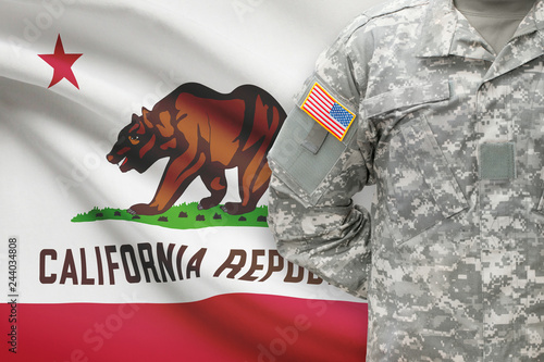 American soldier with US state flag on background - California
