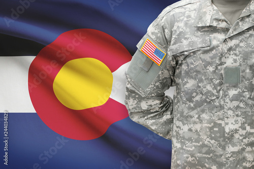 American soldier with US state flag on background - Colorado photo