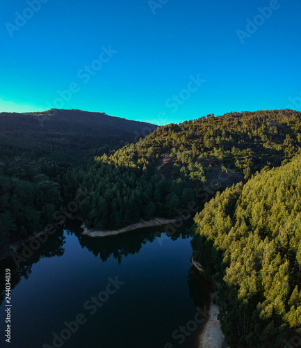 Aerial view of a dam surrounded by a forest. Sintra Portugal