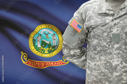 American soldier with US state flag on background - Idaho photo