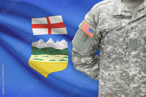 American soldier with Canadian province flag on background - Alberta photo