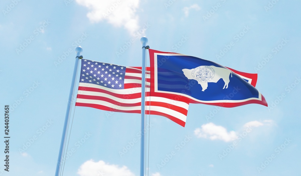USA and state Wyoming, two flags waving against blue sky. 3d image