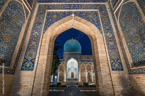 Archway inlaid with vibrant mosaic tile patterns, The Registan, a historic 15th century Madrasa building.