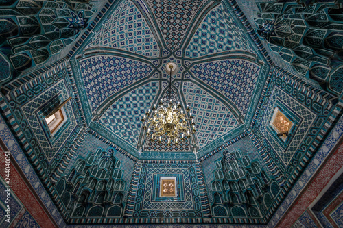 Interior, mosaic patterns in a dome of a Madrasa building in Samarkand. photo