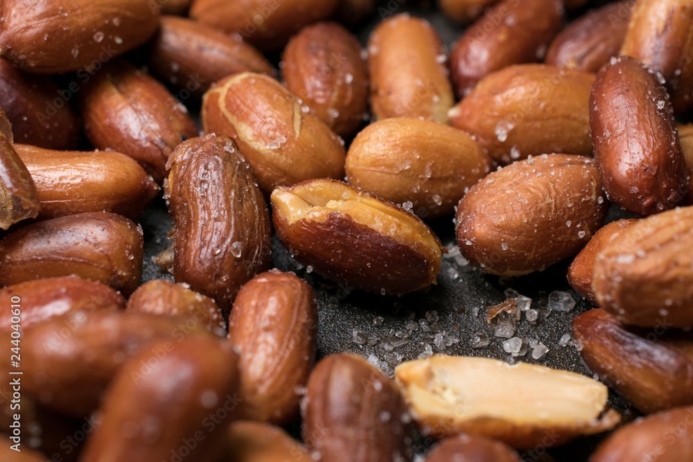 Roasted and salted peanuts with peel close-up Roasted and salted peanuts with peel close-up