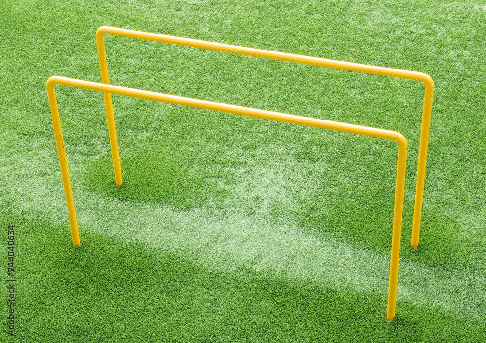 Parallel bars on an AstroTurf pitch used for exercise and fitness. Parallel bars on an AstroTurf pitch used for exercise and fitness.