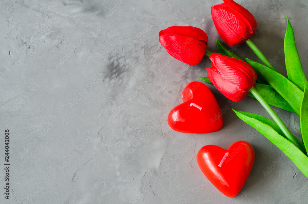 Red tulips and candles in the form of hearts for Valentine's, Women's or Mother's day. Red tulips and candles in the form of hearts for Valentine's, Women's or Mother's day.