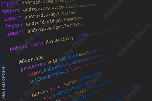 Screen of android application developing code on dark background