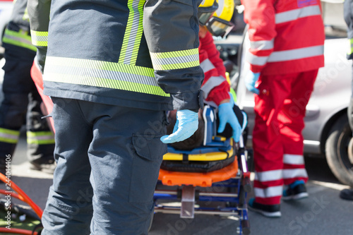 Paramedics and firefighters in a rescue operation after road traffic accident