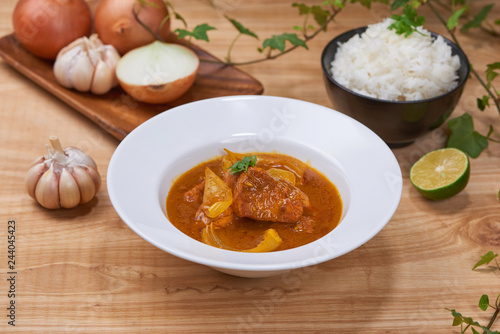 Chicken curry in a bowl / Vietnam chicken curry on wooden background