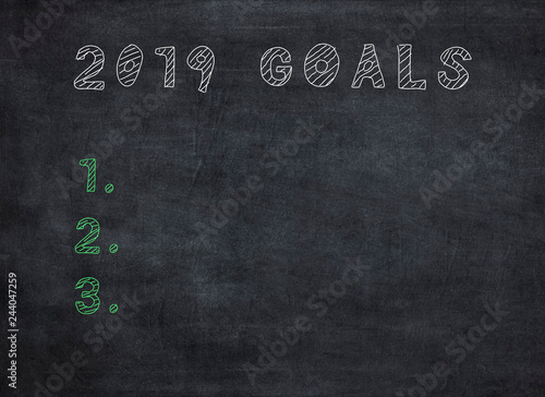 New Year 2019 Goals on Chalkboard Background