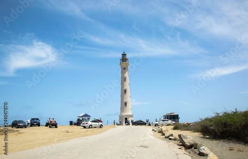 California Lighthouse on blue sky background, Aruba coastline. Nice landscape background.