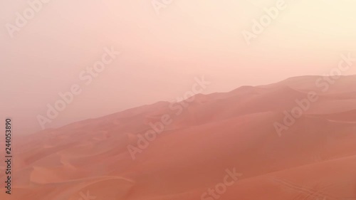 aerial view of massive sand dunes of Liwa desert in a early morning fog 
