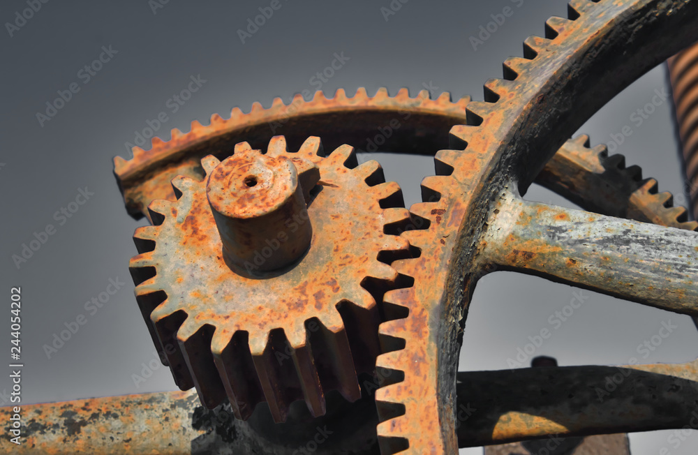 Old rusty metal industrial gears or cogs used in retro machinery